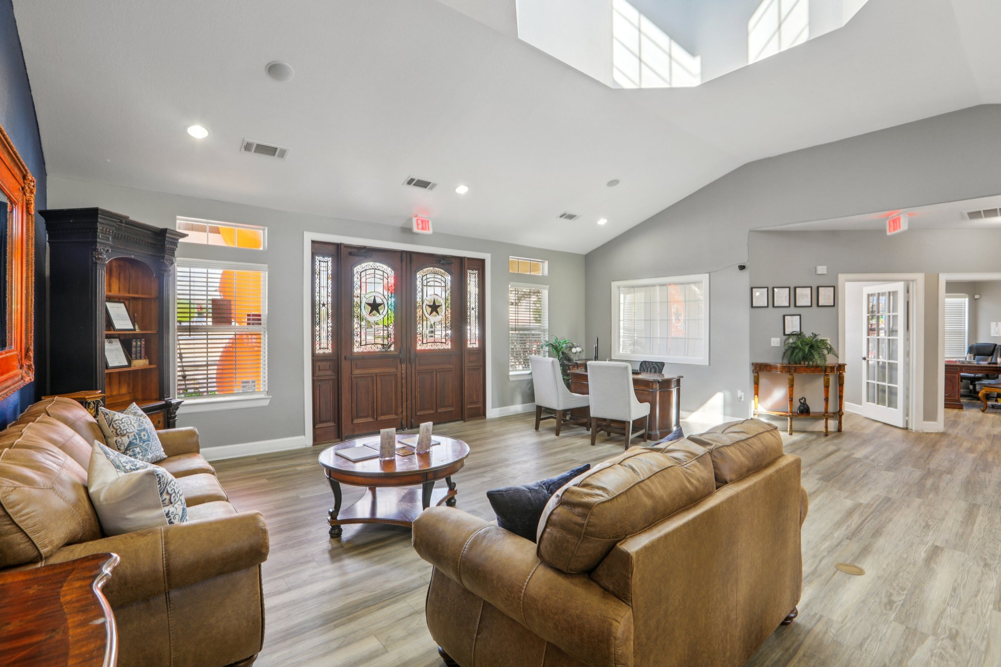 River Valley clubhouse lounge with stained-glass entry doors — Austin, TX